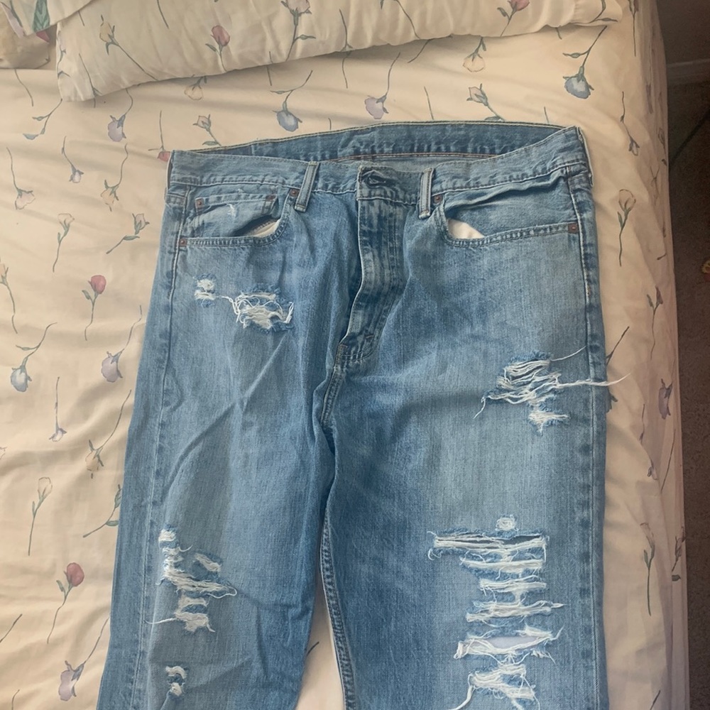 Levi’s 522 taper distressed jeans.